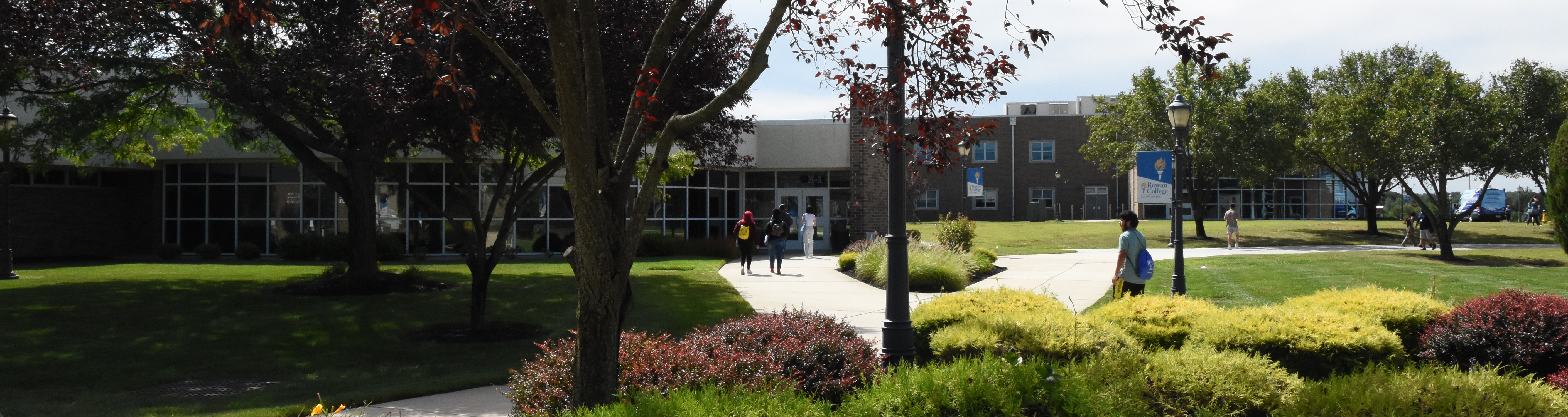 view of campus with students walking in the distance