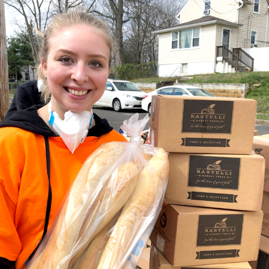 Holly delivering food and supplies to families
