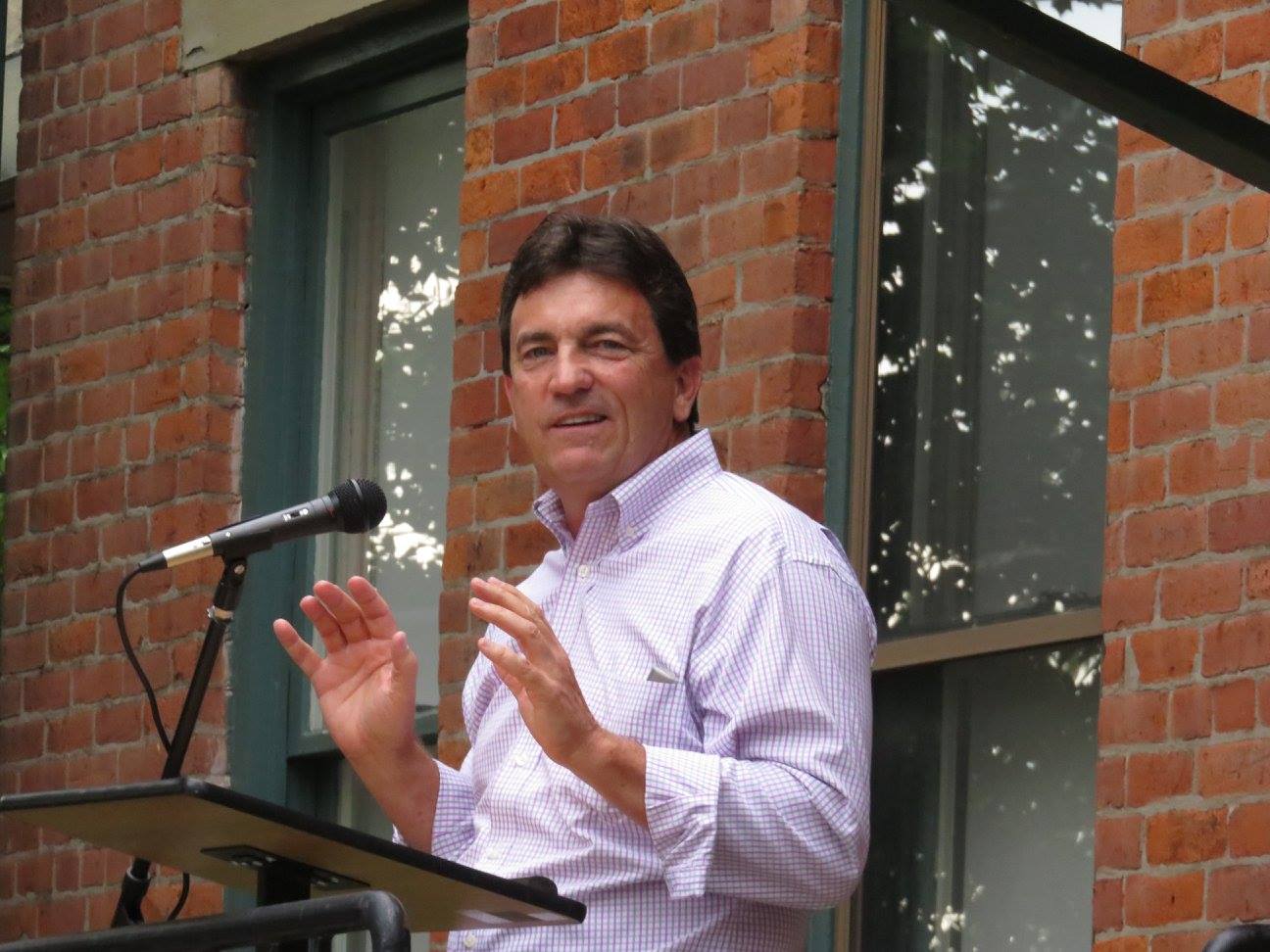 Robin Yocum speaking at a podium