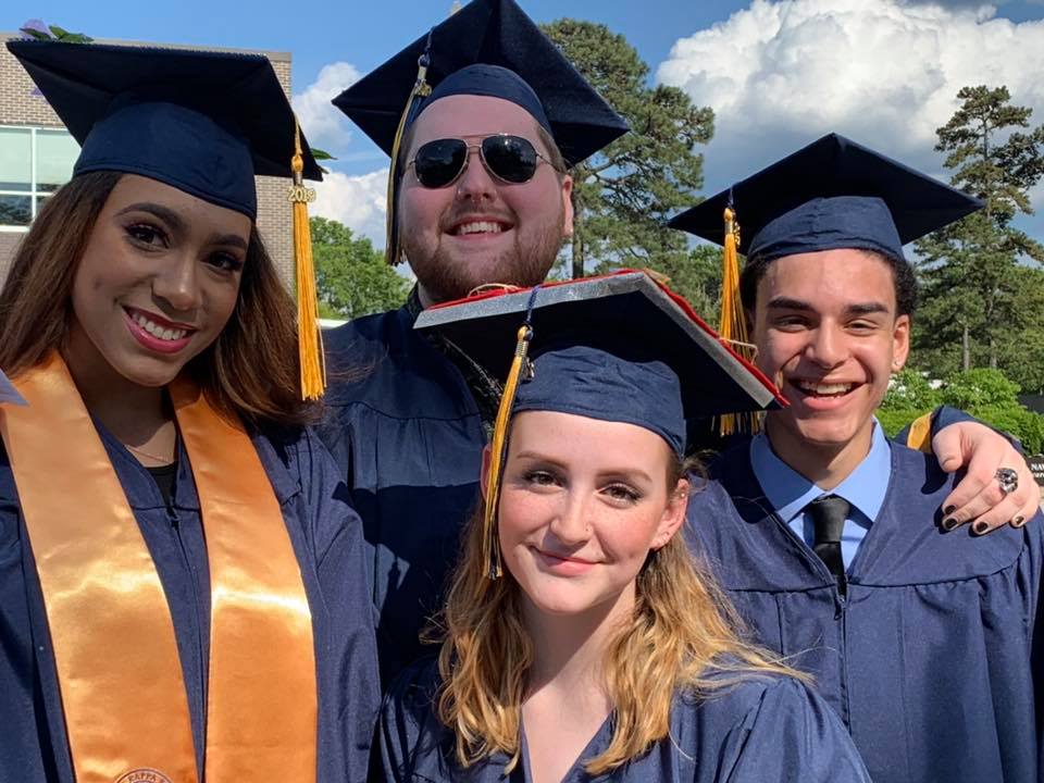 graduates cheer at commencement