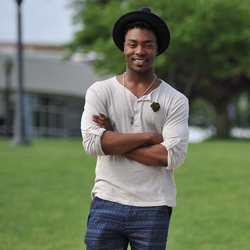 Smiling student standing on campus