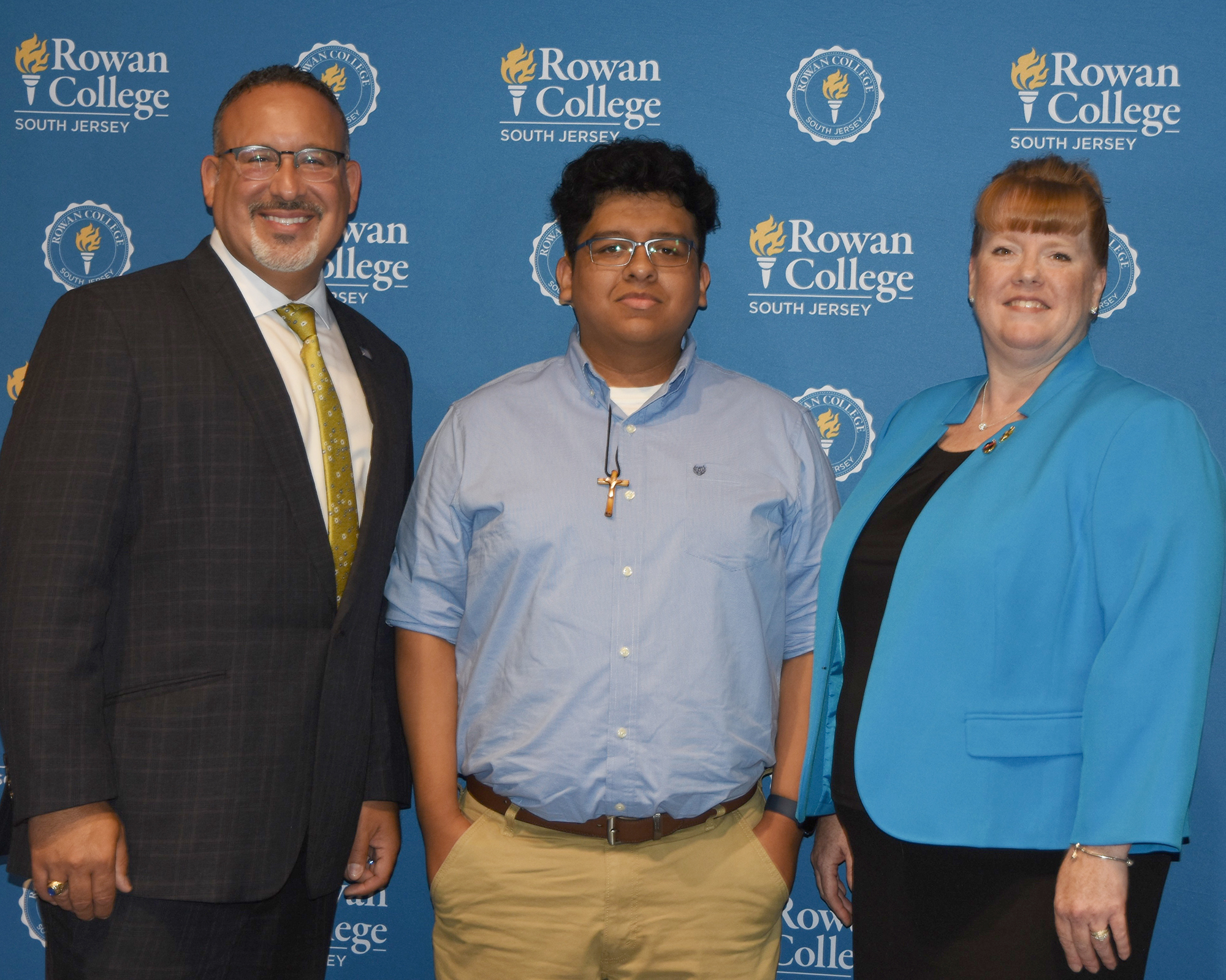 U.S. Department of Education Secretary Miguel Cardona, RCSJ graduates Jesus Calixto and Miriam Craig-Venti.