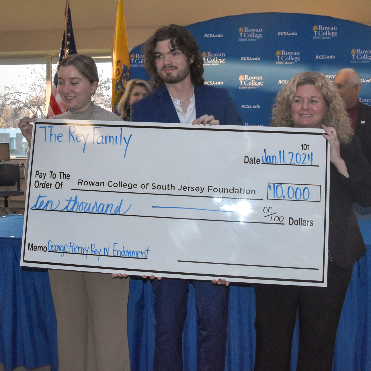 Mrs. Julia Elizabeth “Beth” Rey (far right) and her children, Makenzie Rey and George Rey, V, announce the creation of the Georg