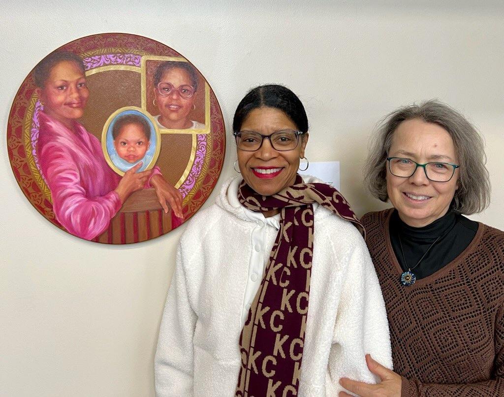RCSJ English Associate Professor, Carthornia Kouroupos (left), and Fine Artist, Ann Hayes (right), stand in front of the portrai