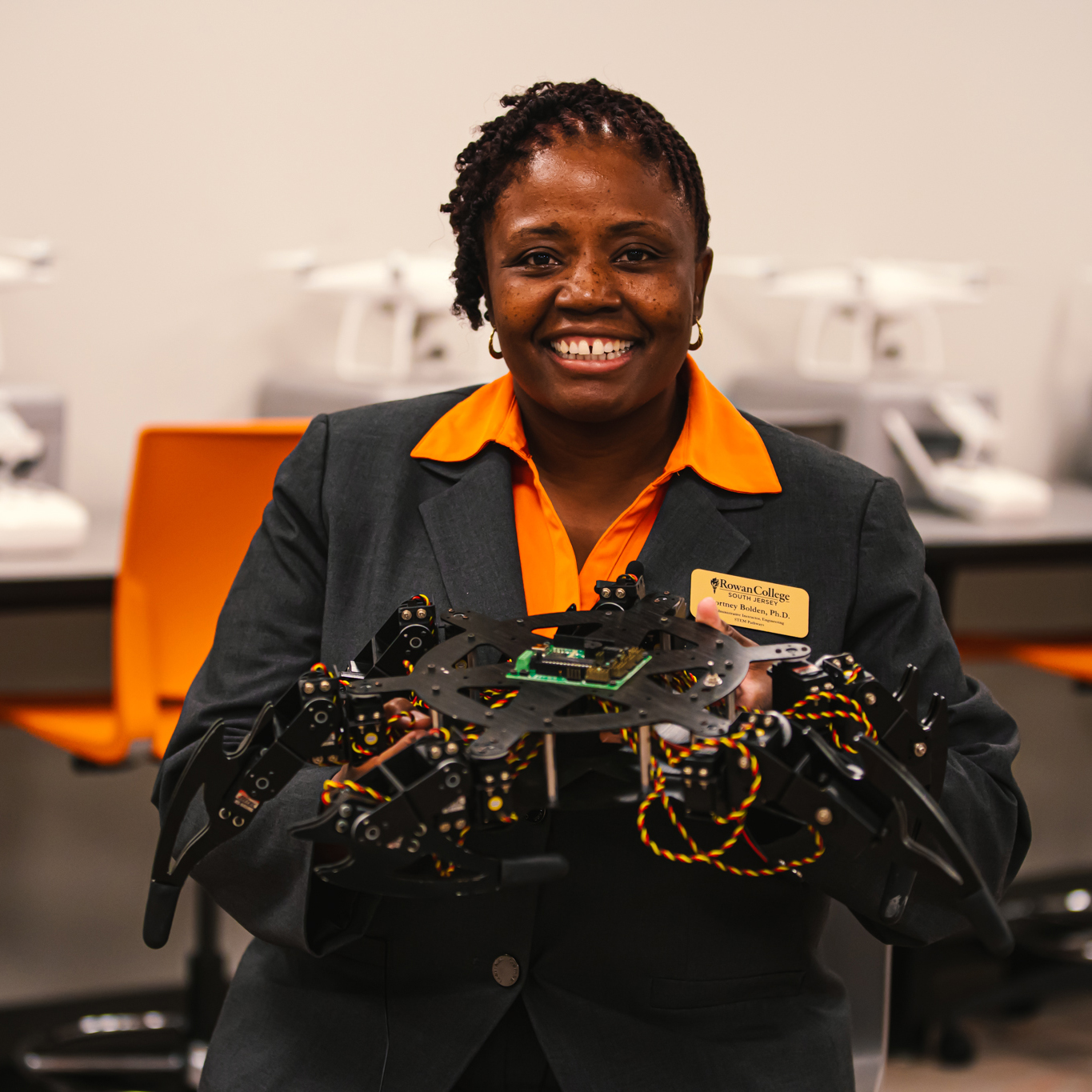Dr. Cortney Bolden, instructor at RCSJ, displays a hexapod robot used by students in the Advanced Manufacturing program. 