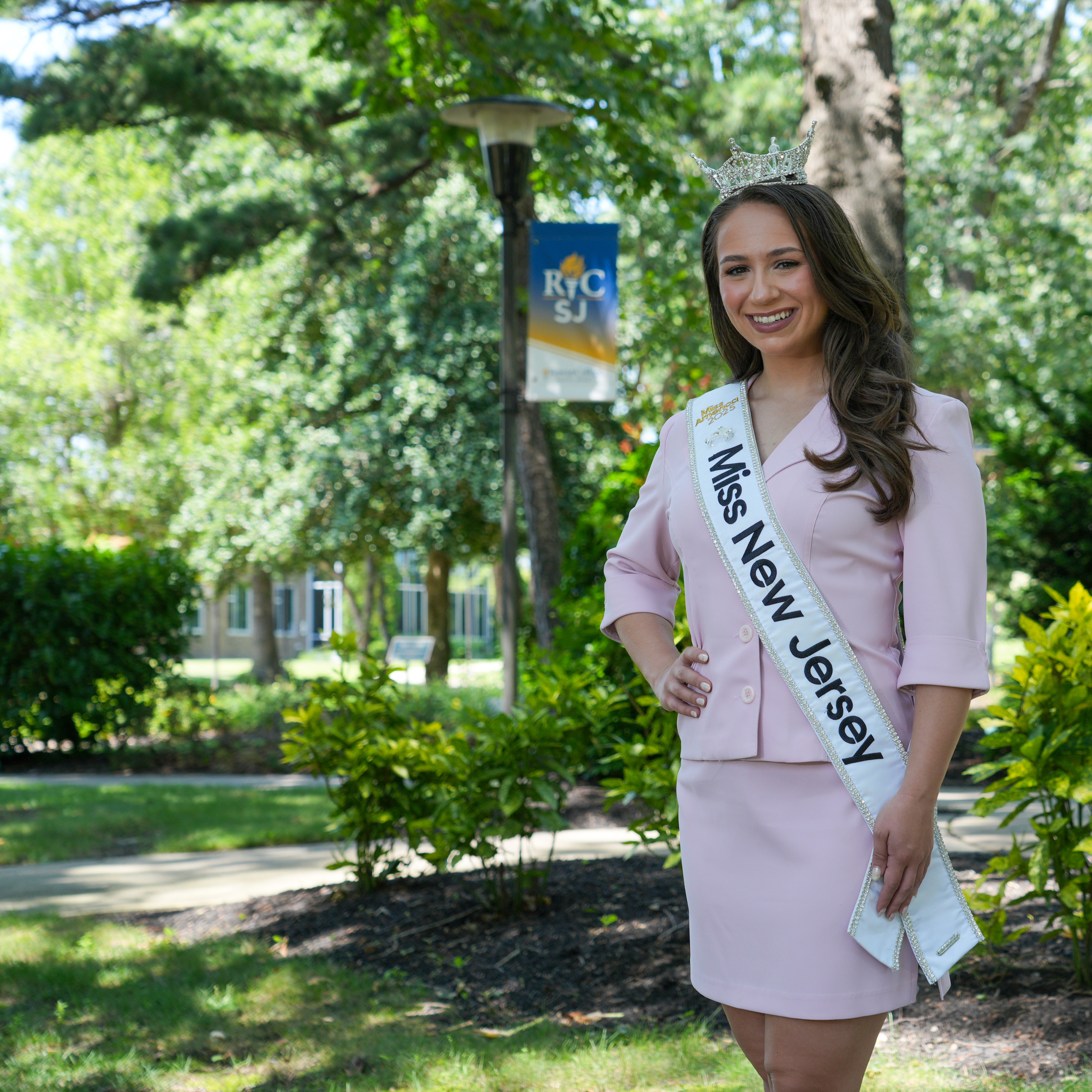 Belle on RCSJ campus wearing the Miss New Jersey sash