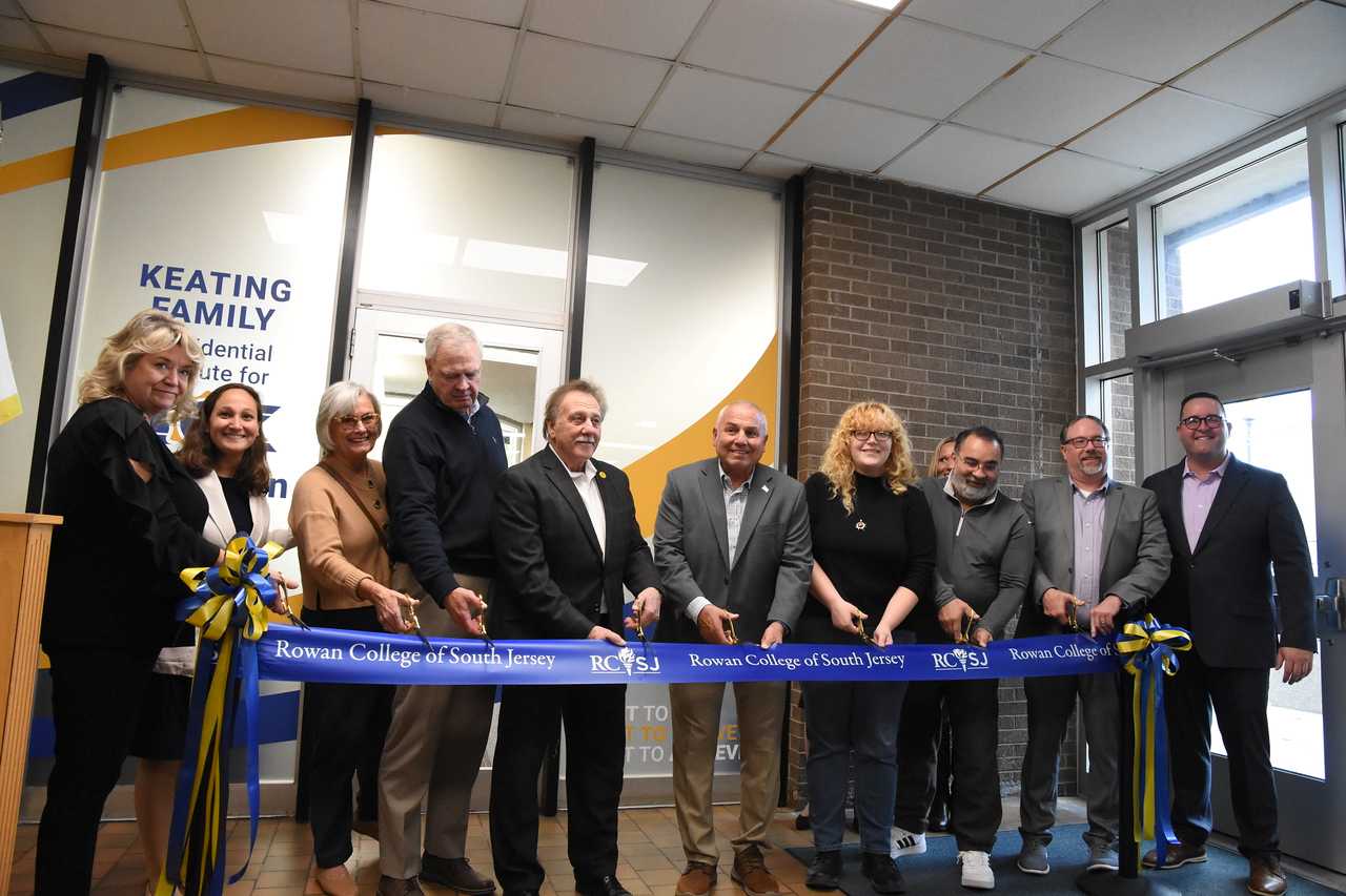 President Emeritus, F. Keating, Ed.D., and and others cut the ribbon on the Dr. Frederick Keating Commemorative Room 