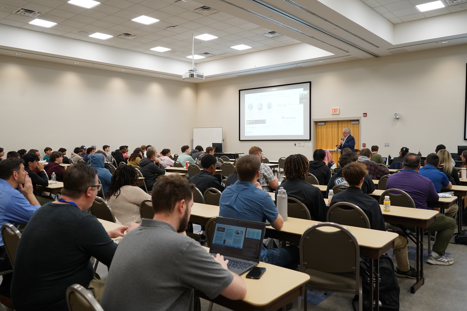 Students in a classroom during the third annual Cybersecurity Symposium 
