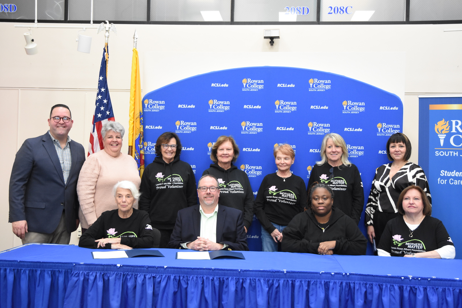 members from the Lauren Rose Albert Foundation, Foundation Leadership, & RCSJ at the signing ceremony