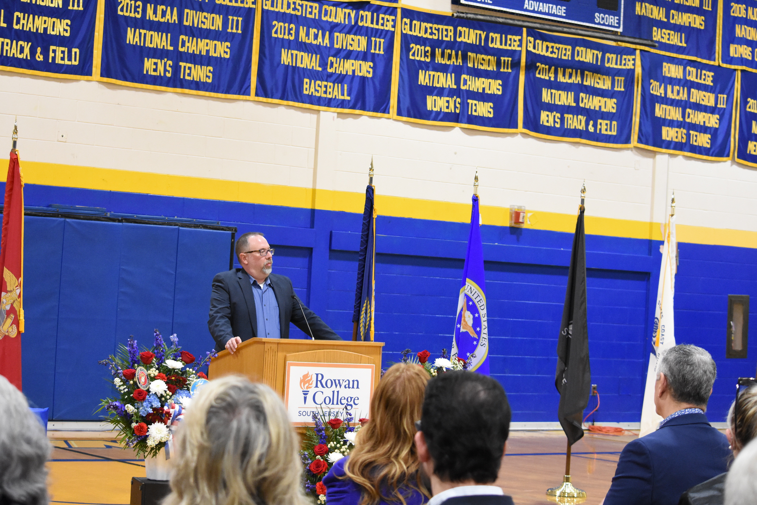 Brenden Rickards speaking at a Military Services event on campus