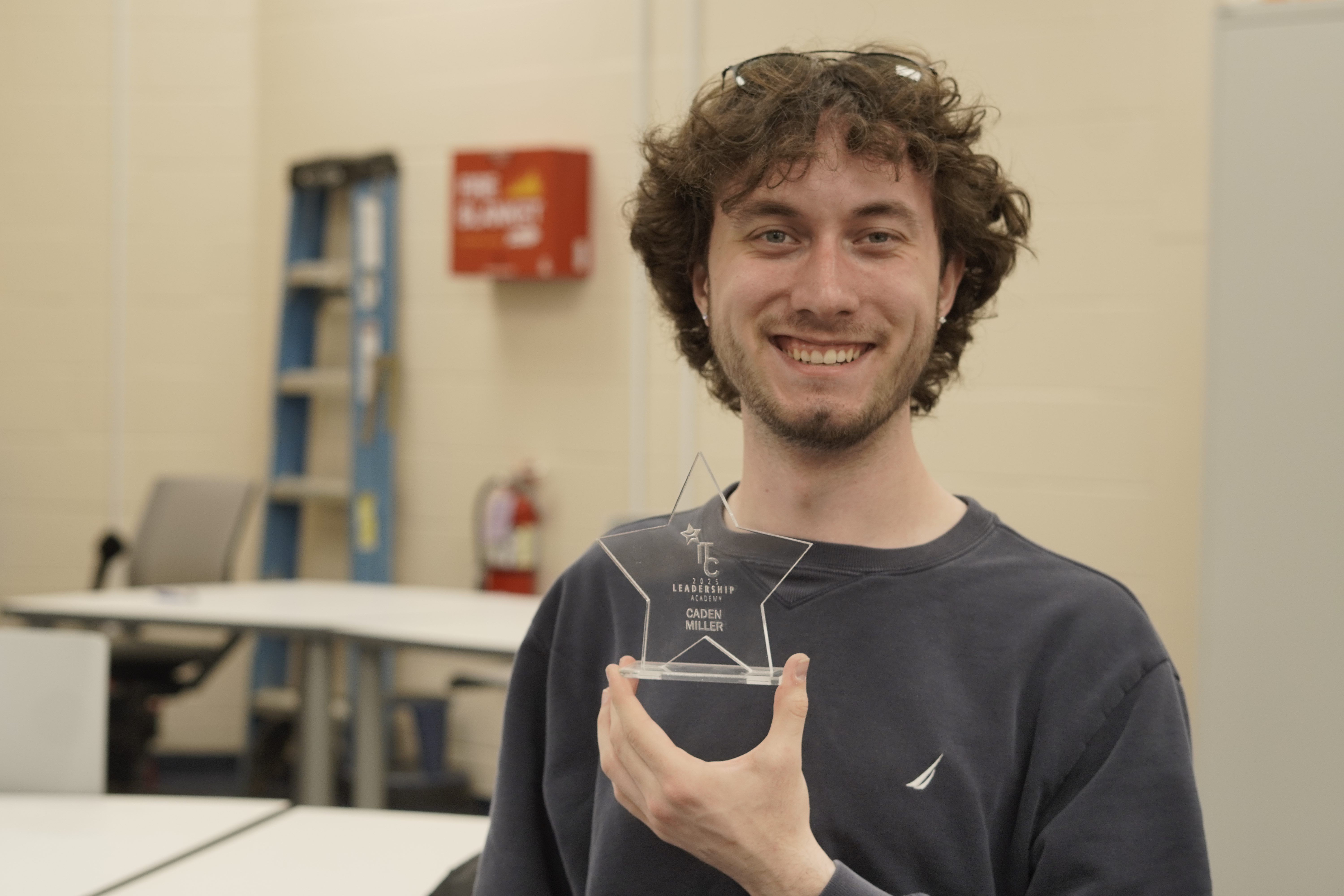RCSJ student worker Caden Miller, from Westville, with his custom-designed award 