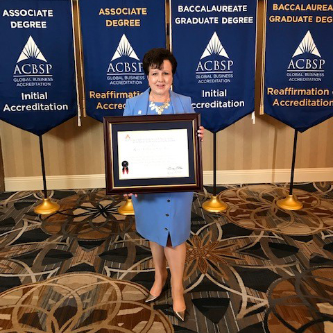 : Dr. Patricia Claghorn, Dean of Business Studies, accepting RCSJ’s Certificate of Accreditation at the Accreditation Council fo