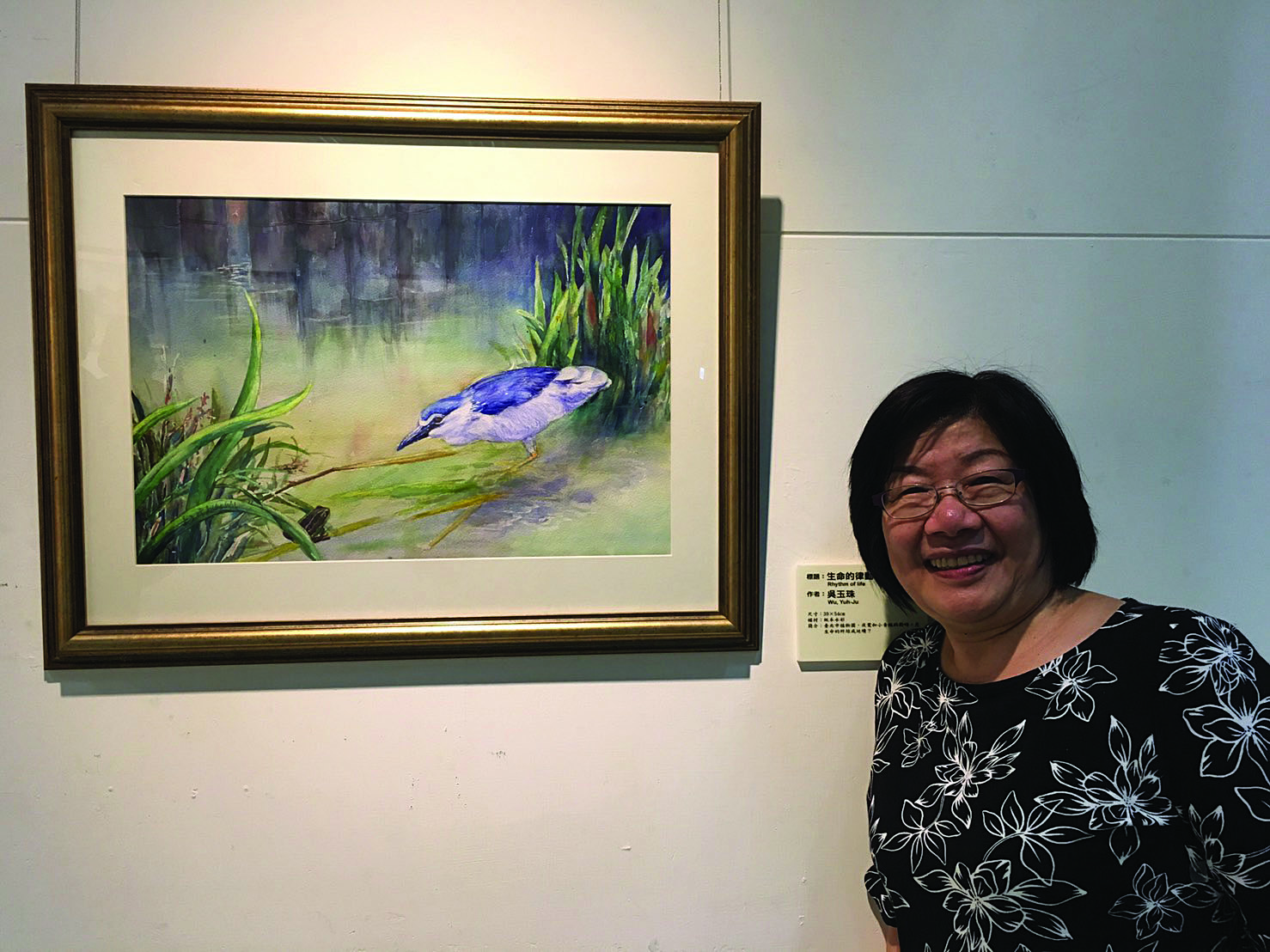 Award-winning artist Judy Wu pictured with her watercolor painting