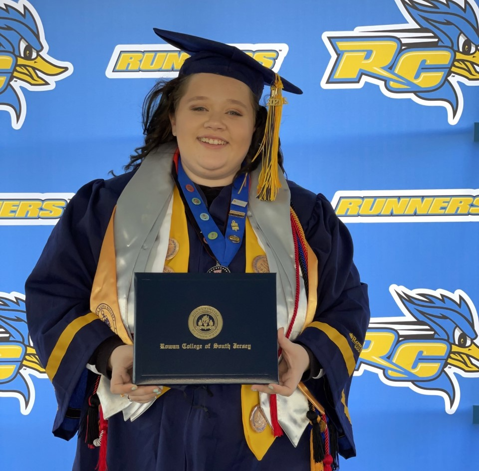 Bickings with her diploma at the 2021 RCSJ Commencement