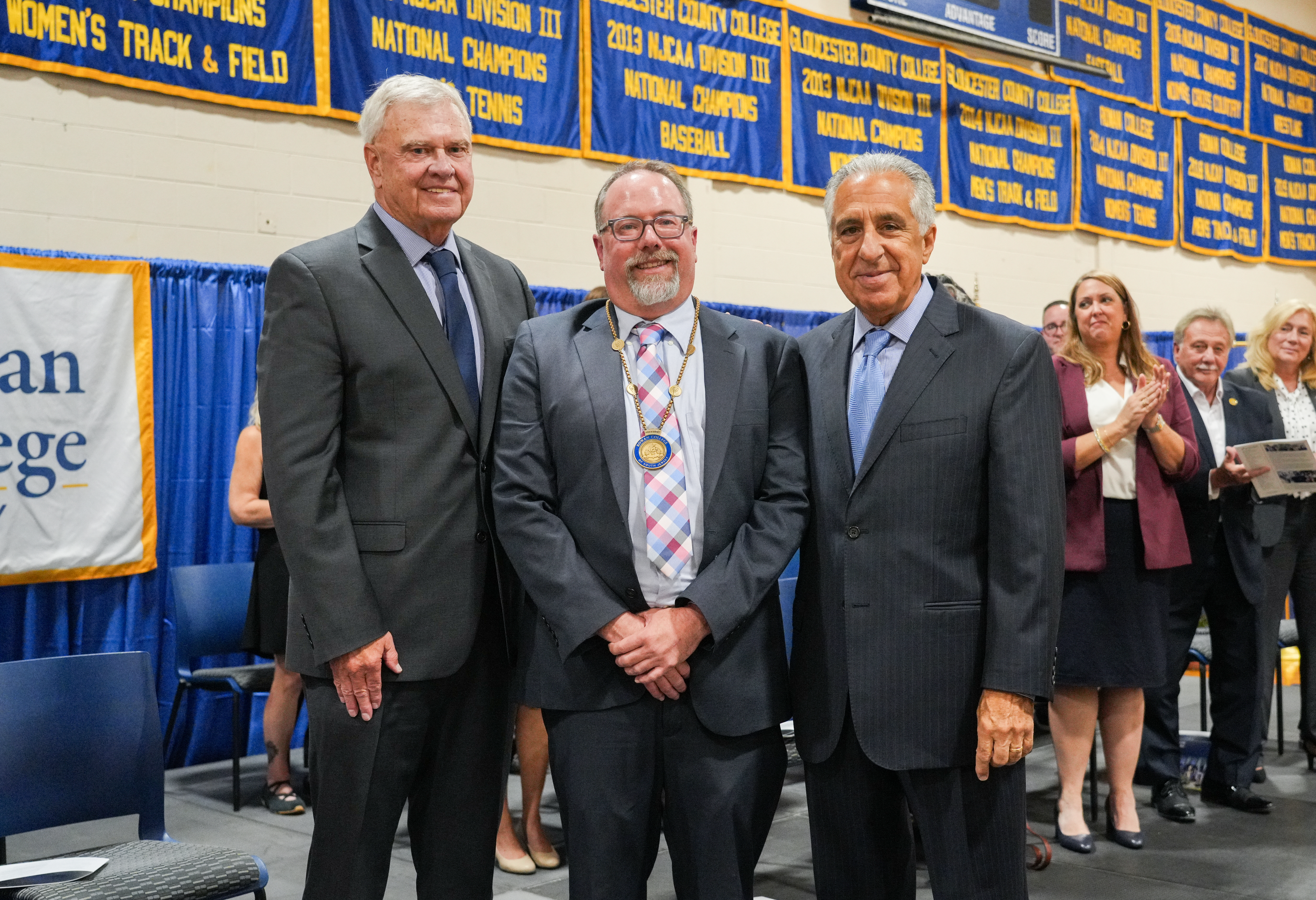 Dr. Brenden Rickards is congratulated after receiving Rowan College of South Jersey's Presidential Medallion at his inauguration ceremony,