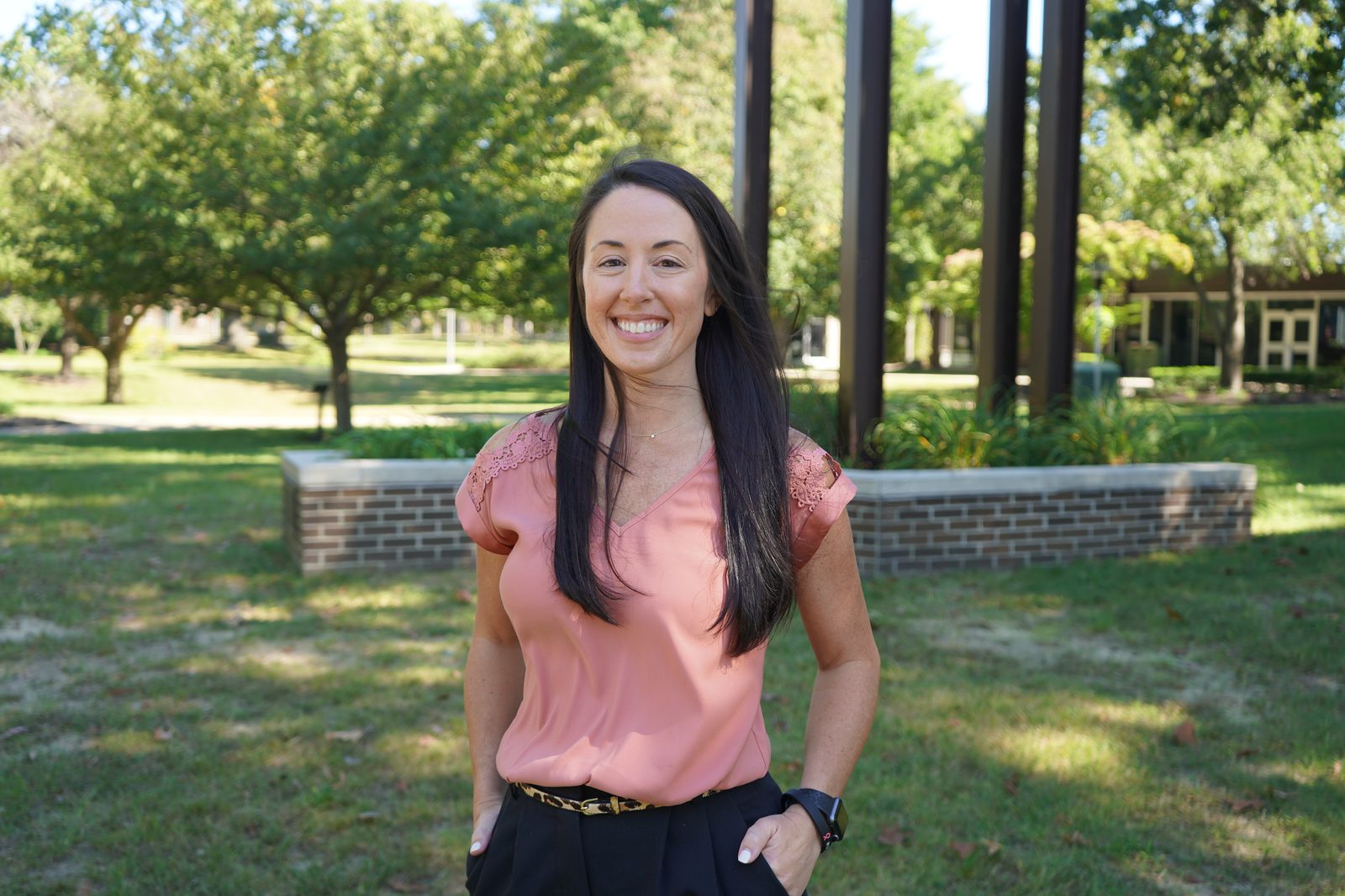 Rowan College of South Jersey–Cumberland's Assistant Athletic Director, Jeanna DuBois, stands near the clocktower as she shares her breast cancer experience.