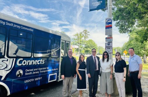 New Jersey state officials, chamber of commerce, SJTA and RCSJ officials pose at a bus stop on the RCSJ–Cumberland campus next to a SJ Connects bus. L-R: Assemblyman Cody Miller; RCSJ Vice President Communications, Marketing and Enrollment Management Susan Nardelli; NJ State Senator Michael Testa;, President & CEO Chamber of Commerce Southern New Jersey Christina M. Renna; Director, Government Affairs Chamber of Commerce Southern New Jersey Hilary Chebra; Executive Director South Jersey Transportation Authority Stephen Dougherty.