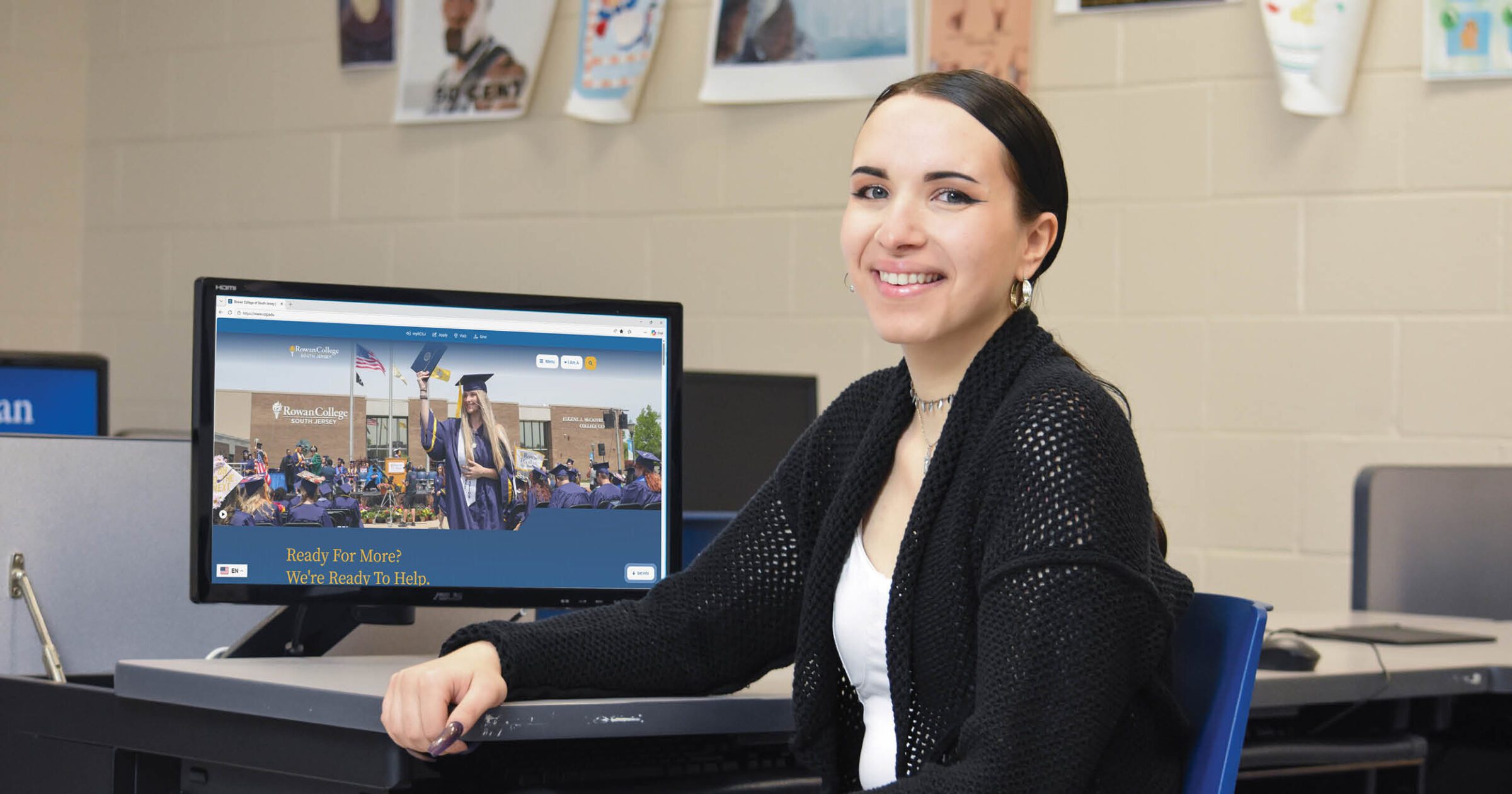 Student sits in computer lab looking at RCSJ's new website.