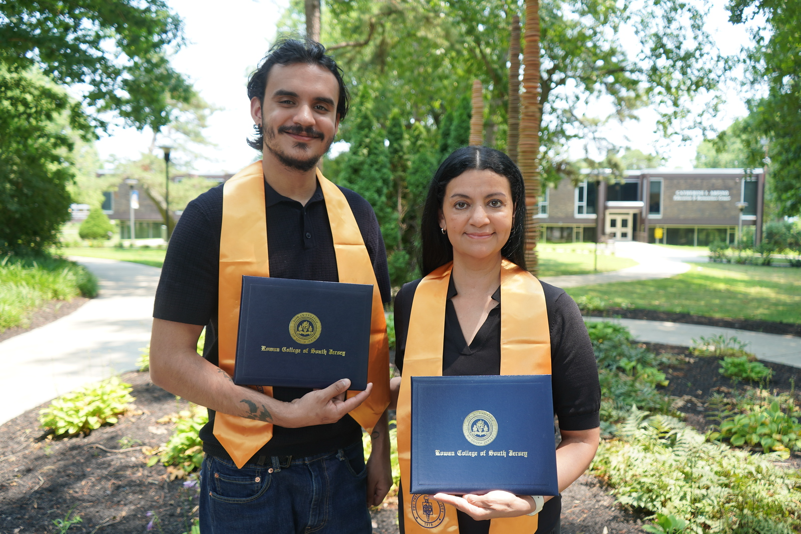 Mother and son, Branden and Brenda Zeitone, proudly display the diploma jackets they received after graduating together during Rowan College of South Jersey–Cumberland's Seventh Annual Commencement Ceremony in May.